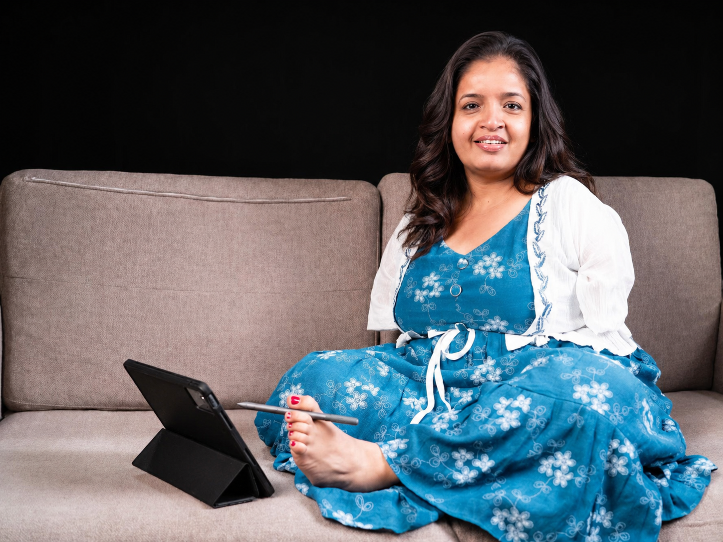 Saraswati Sharma working on a tablet